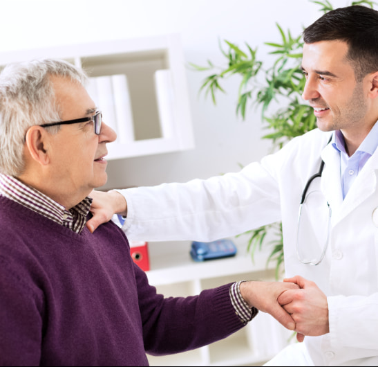 Doctor shaking hands with man